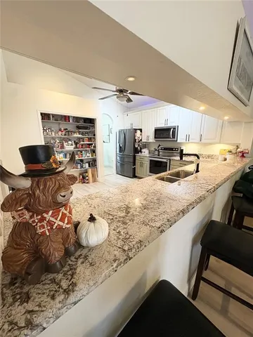 a bedroom with a bed and a wooden floor