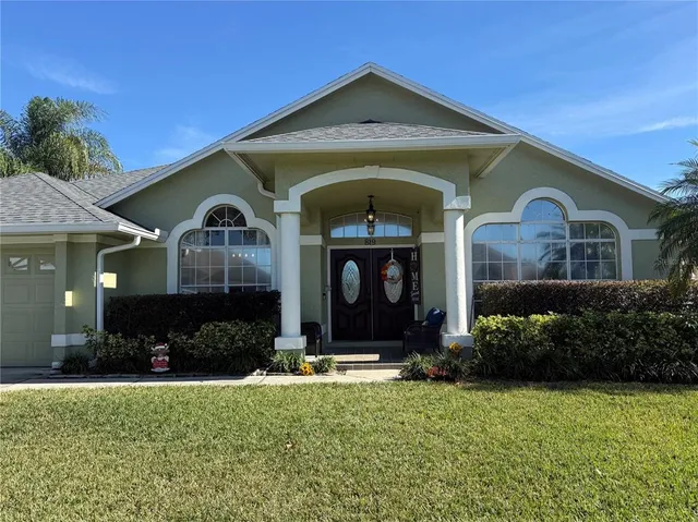 a front view of a house with garden