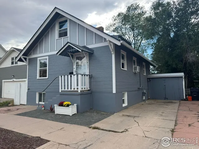 a front view of a house with parking