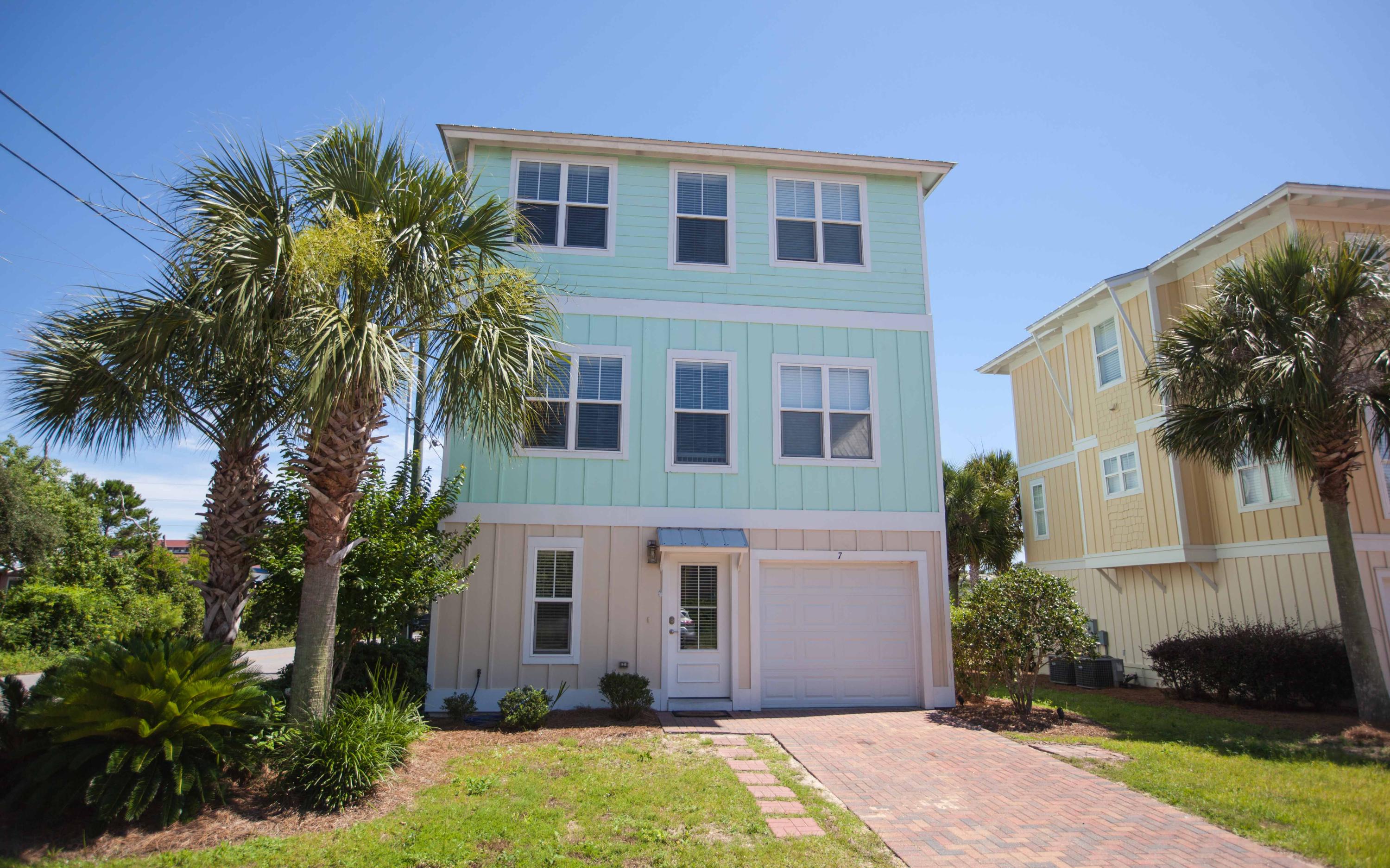 7 Windward Cove Santa Rosa Beach, FL 32459 - Photo 1 of 25 a front view of a house with a garden