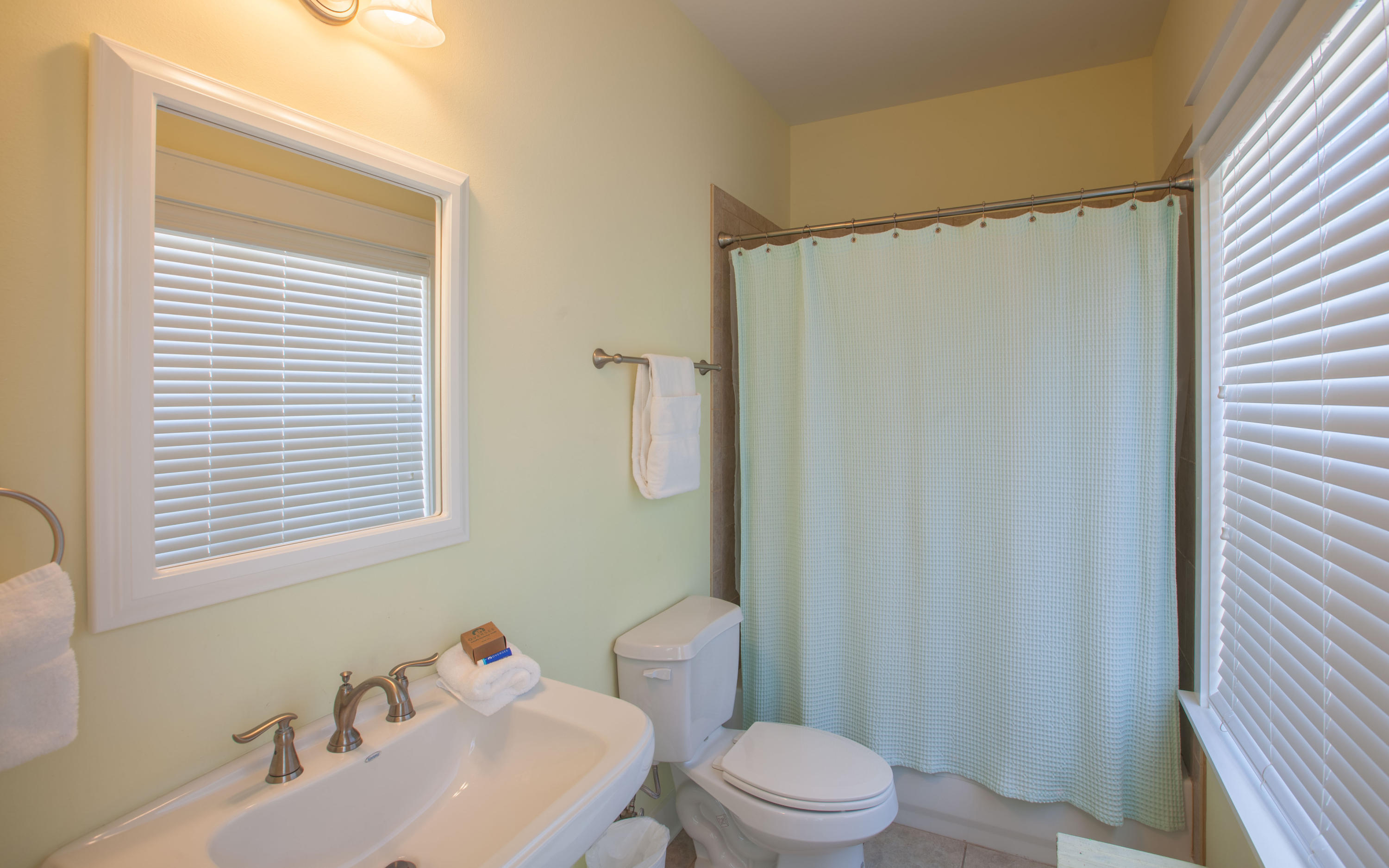 7 Windward Cove Santa Rosa Beach, FL 32459 - Photo 12 of 25 a bathroom with a sink a toilet a mirror and shower