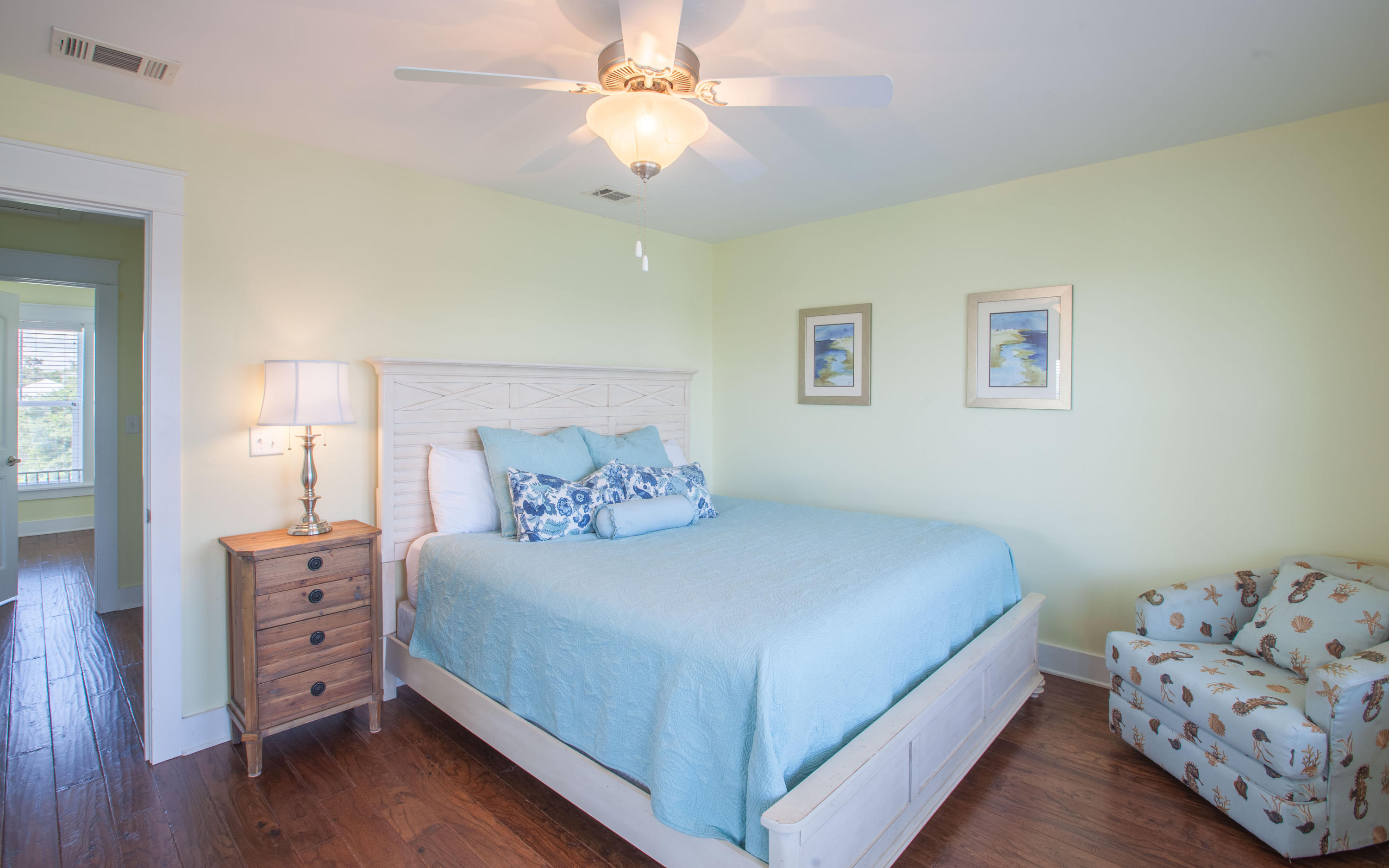 7 Windward Cove Santa Rosa Beach, FL 32459 - Photo 13 of 25 a bedroom with a bed and a chandelier