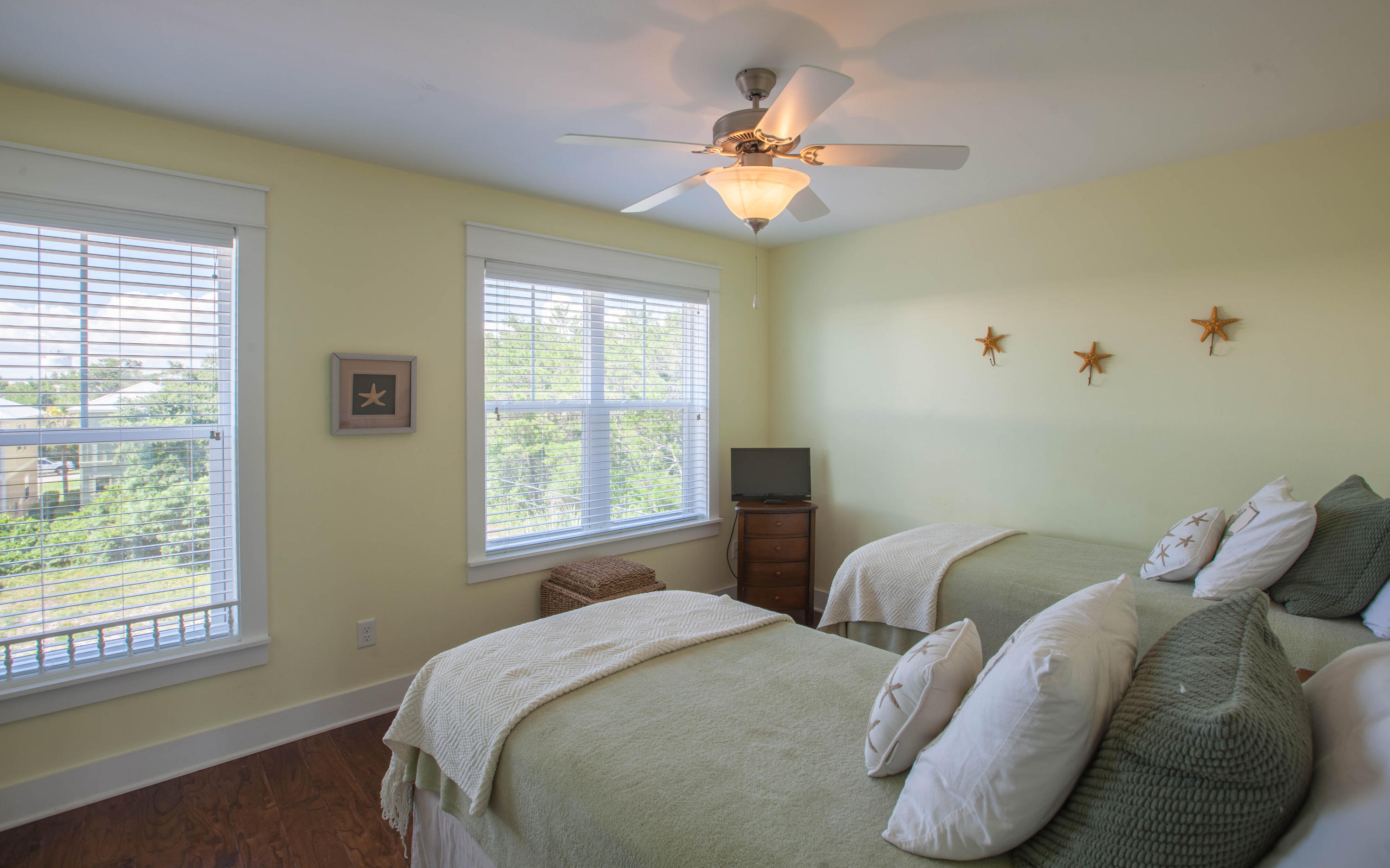 7 Windward Cove Santa Rosa Beach, FL 32459 - Photo 17 of 25 a bedroom with two beds and a chandelier