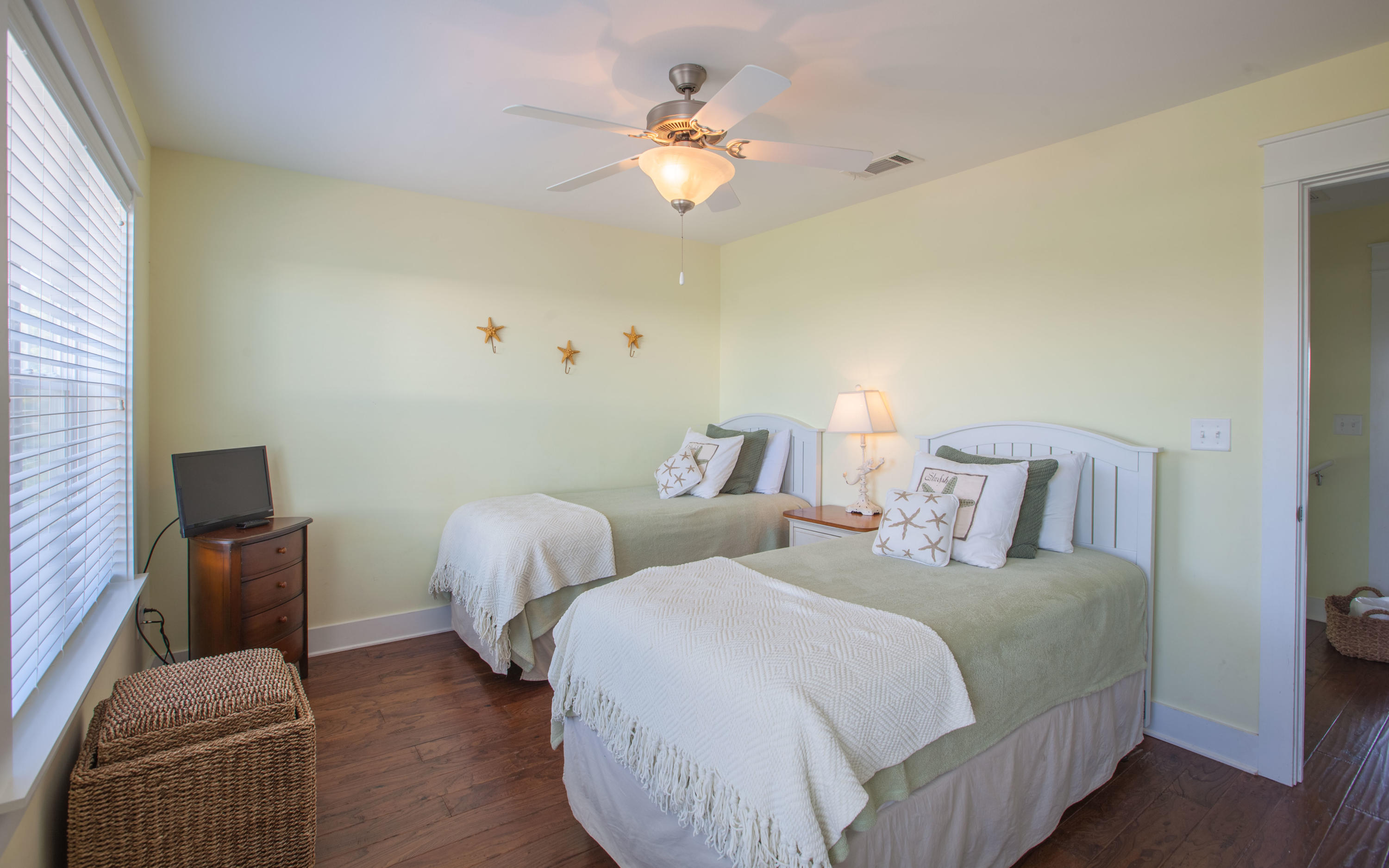 7 Windward Cove Santa Rosa Beach, FL 32459 - Photo 18 of 25 a bedroom with two beds and a chandelier