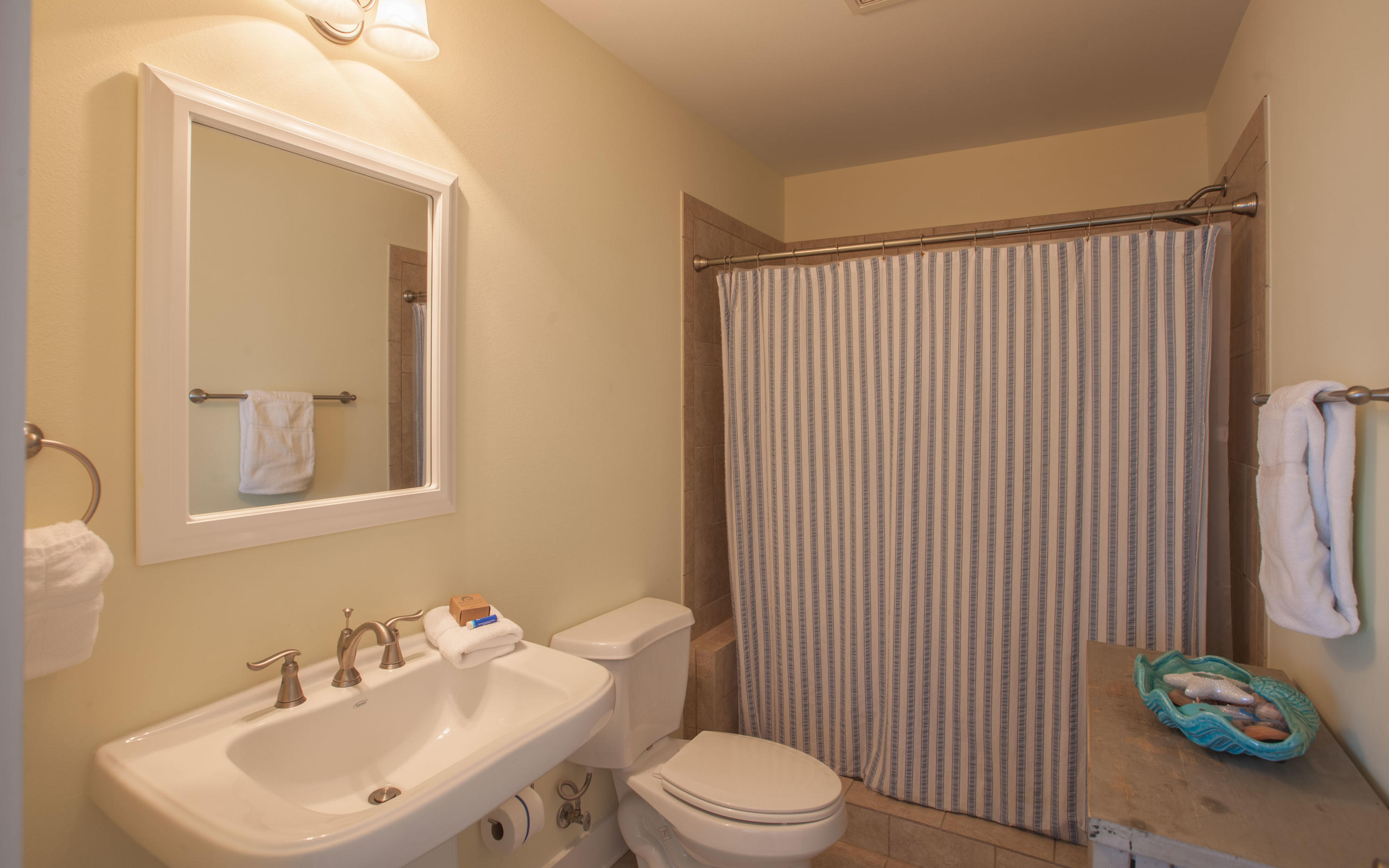 7 Windward Cove Santa Rosa Beach, FL 32459 - Photo 5 of 25 a bathroom with a toilet sink vanity and mirror