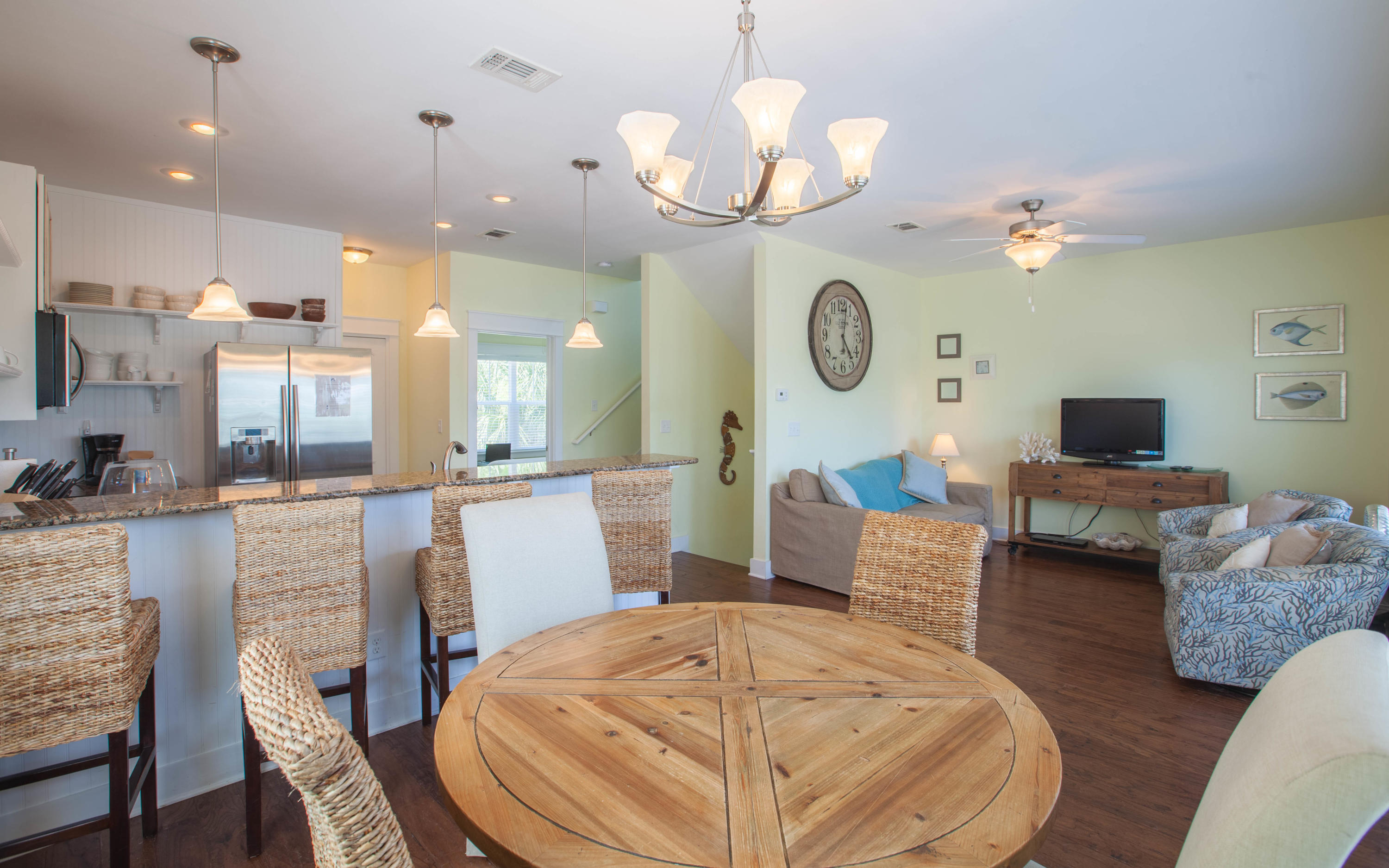 7 Windward Cove Santa Rosa Beach, FL 32459 - Photo 6 of 25 a living room with couches a dining table and chairs with wooden floor