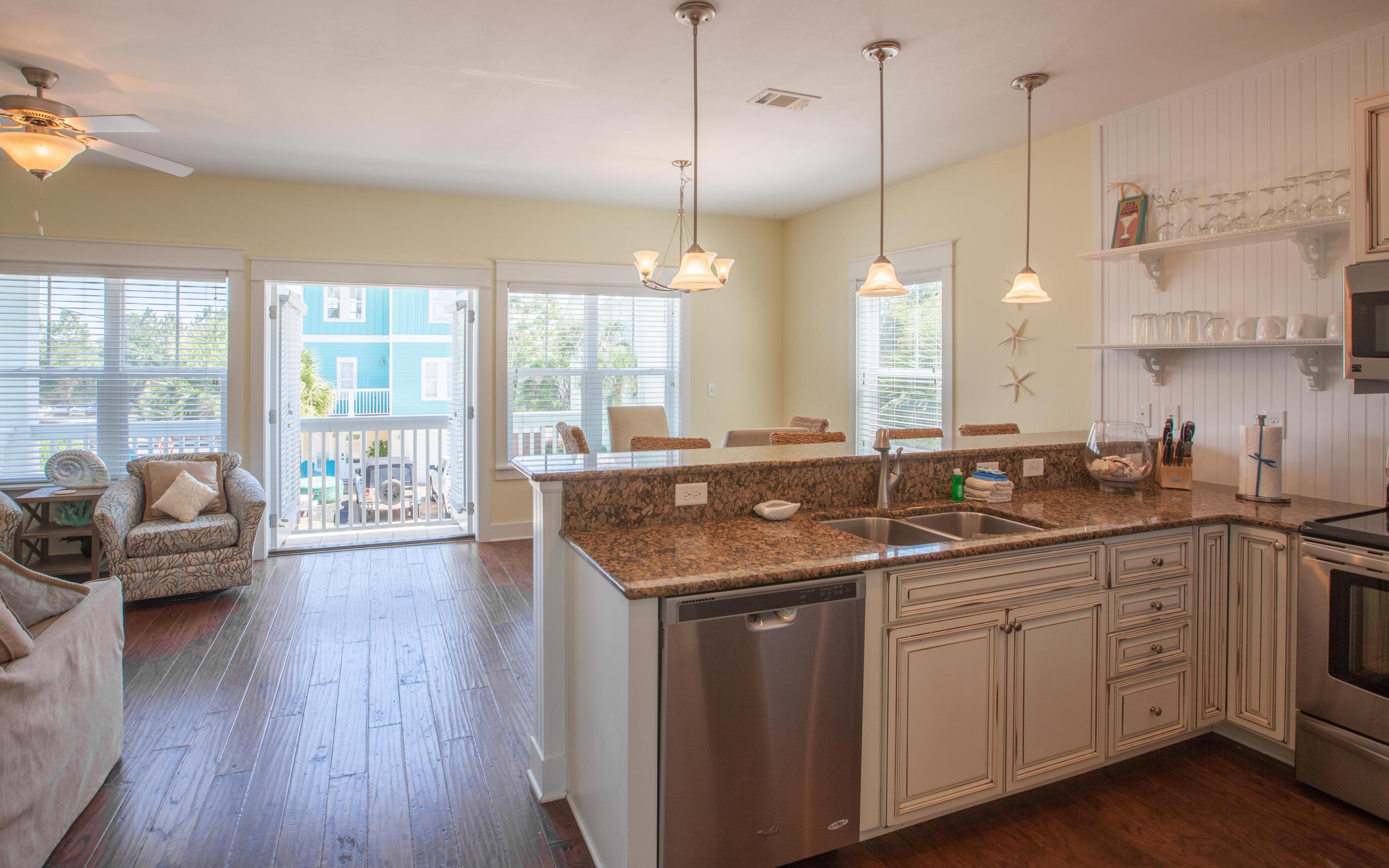 7 Windward Cove Santa Rosa Beach, FL 32459 - Photo 7 of 25 a kitchen with sink stove and wooden floor
