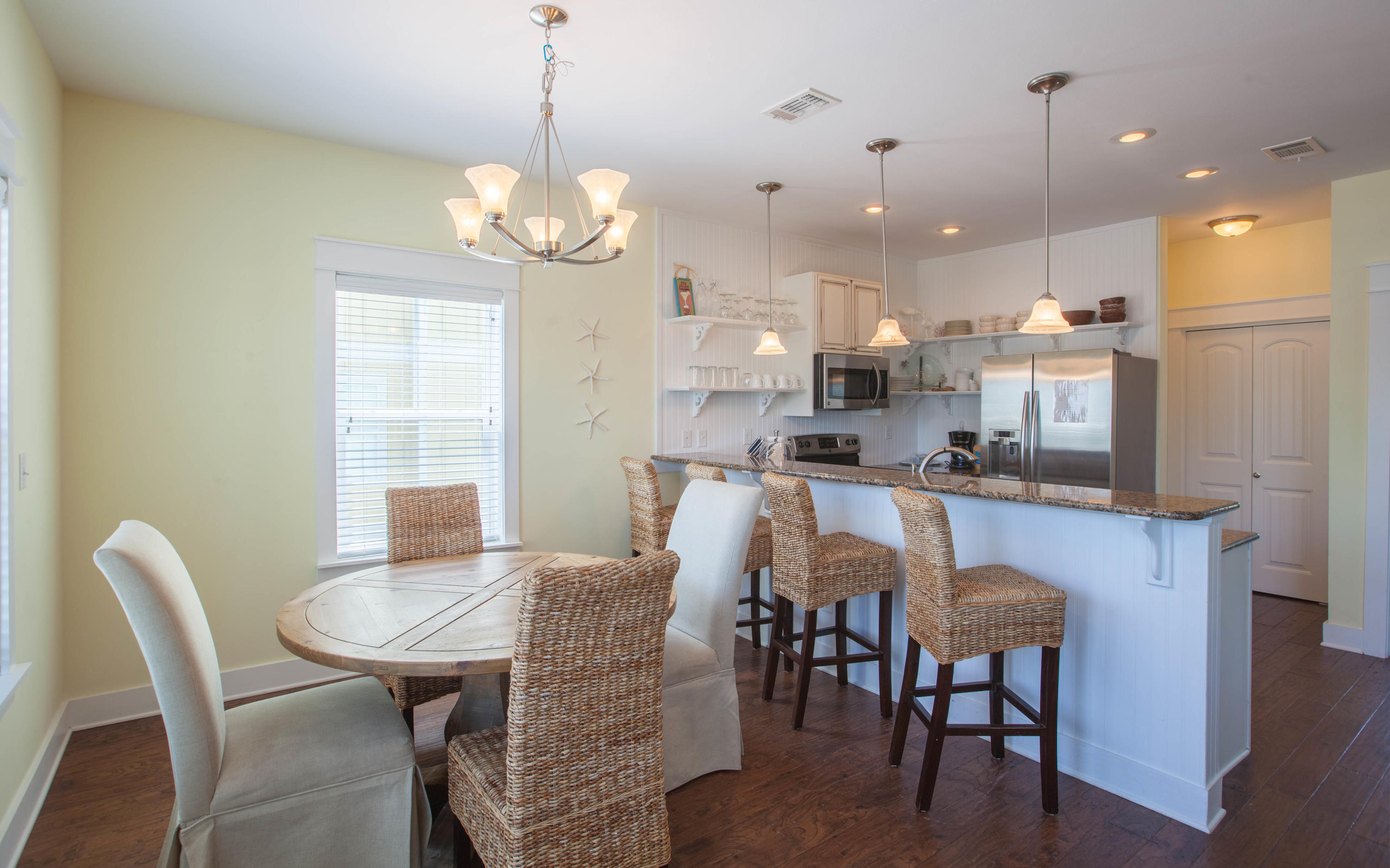 7 Windward Cove Santa Rosa Beach, FL 32459 - Photo 8 of 25 a dining room filled chandelier and kitchen view