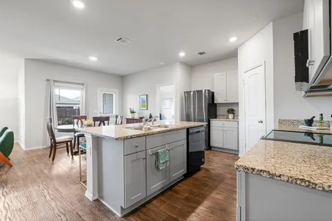 a living room with furniture and a table