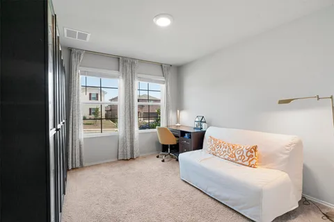 a bathroom with a sink mirror vanity and toilet