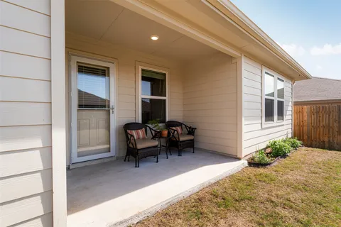 a house view with swimming pool in front of it