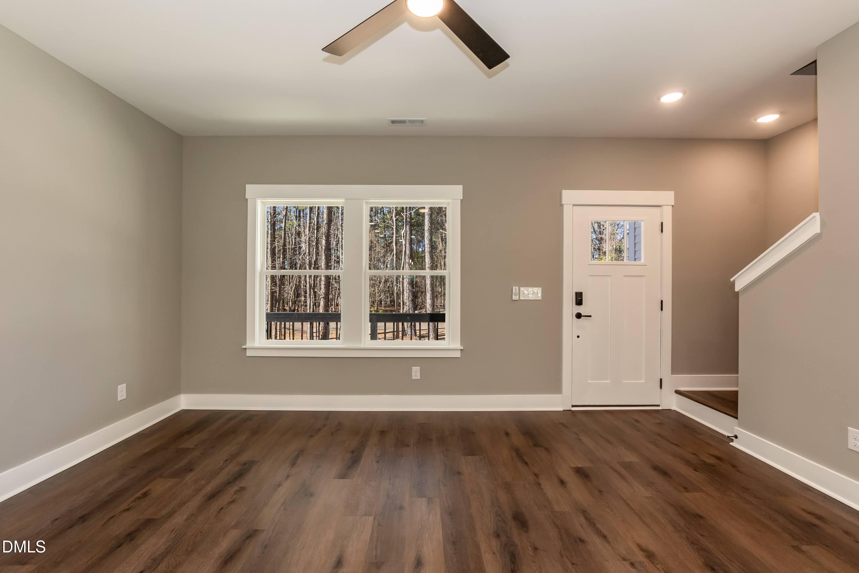 104 Buffalo Drive Spring Hope, NC 27882 - Photo 18 of 48 an empty room with ceiling fan and window