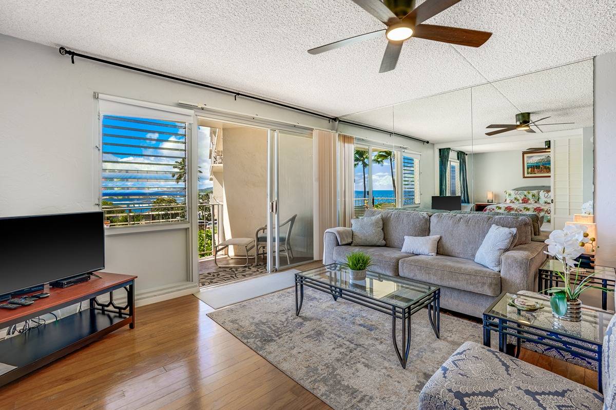 1763 Pe'e Road, Unit 204 Koloa, HI 96756 - Photo 15 of 29 a living room with furniture and a flat screen tv