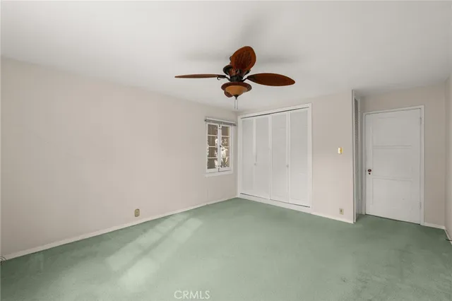a view of a house with wooden floor and stairs