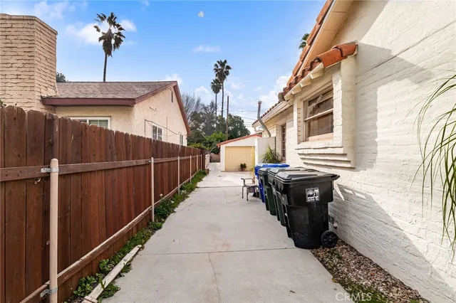 a view of a house with backyard and a patio