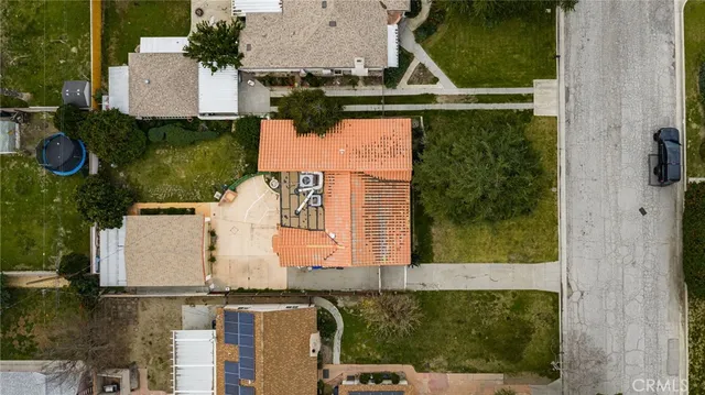 an aerial view of residential houses with outdoor space