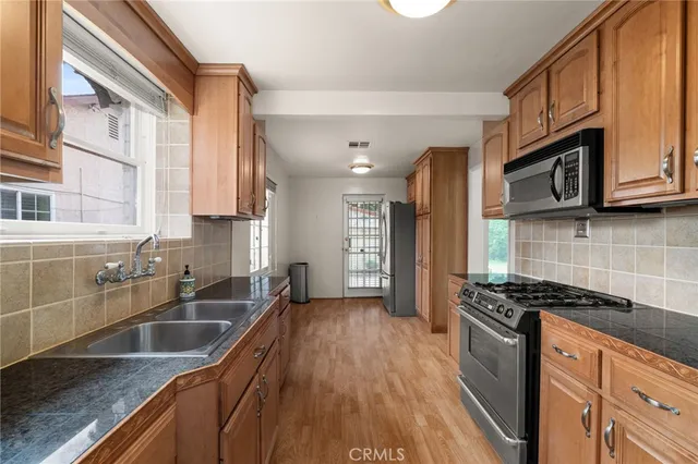 a view of entryway with wooden floor and stairs