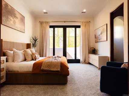 a bedroom with a bed and a couch