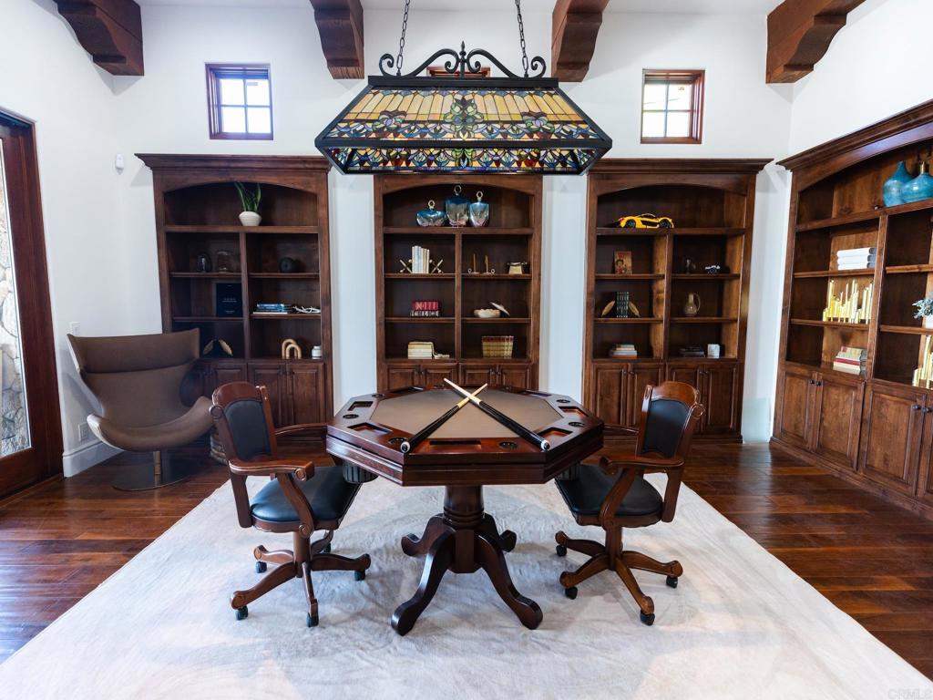18000 Sunset Point Road Poway, CA 92064 - Photo 16 of 20 a view of a livingroom with workspace and a couch
