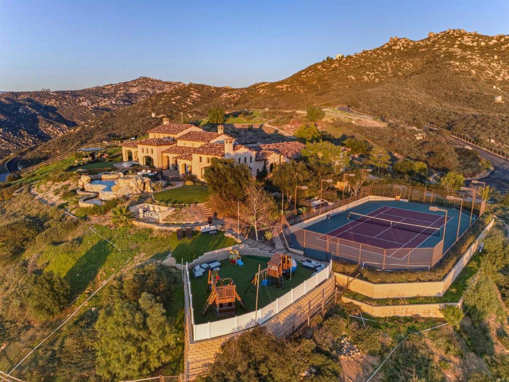 18000 Sunset Point Road Poway, CA 92064 - Photo 3 of 20 a view of a house with a mountain
