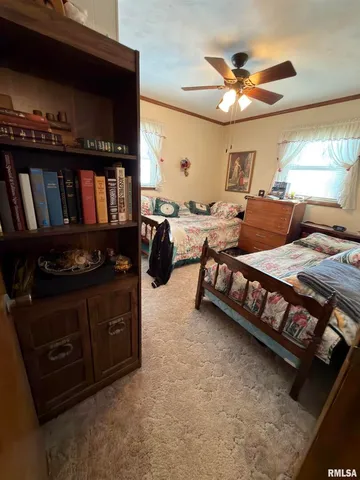 a bedroom with furniture and a window