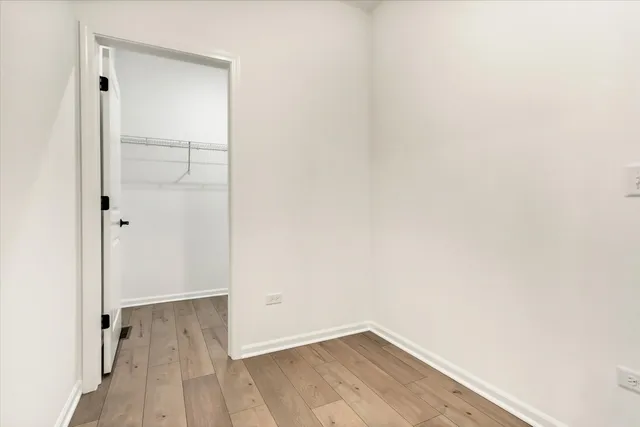 a view of a small space with wooden floor