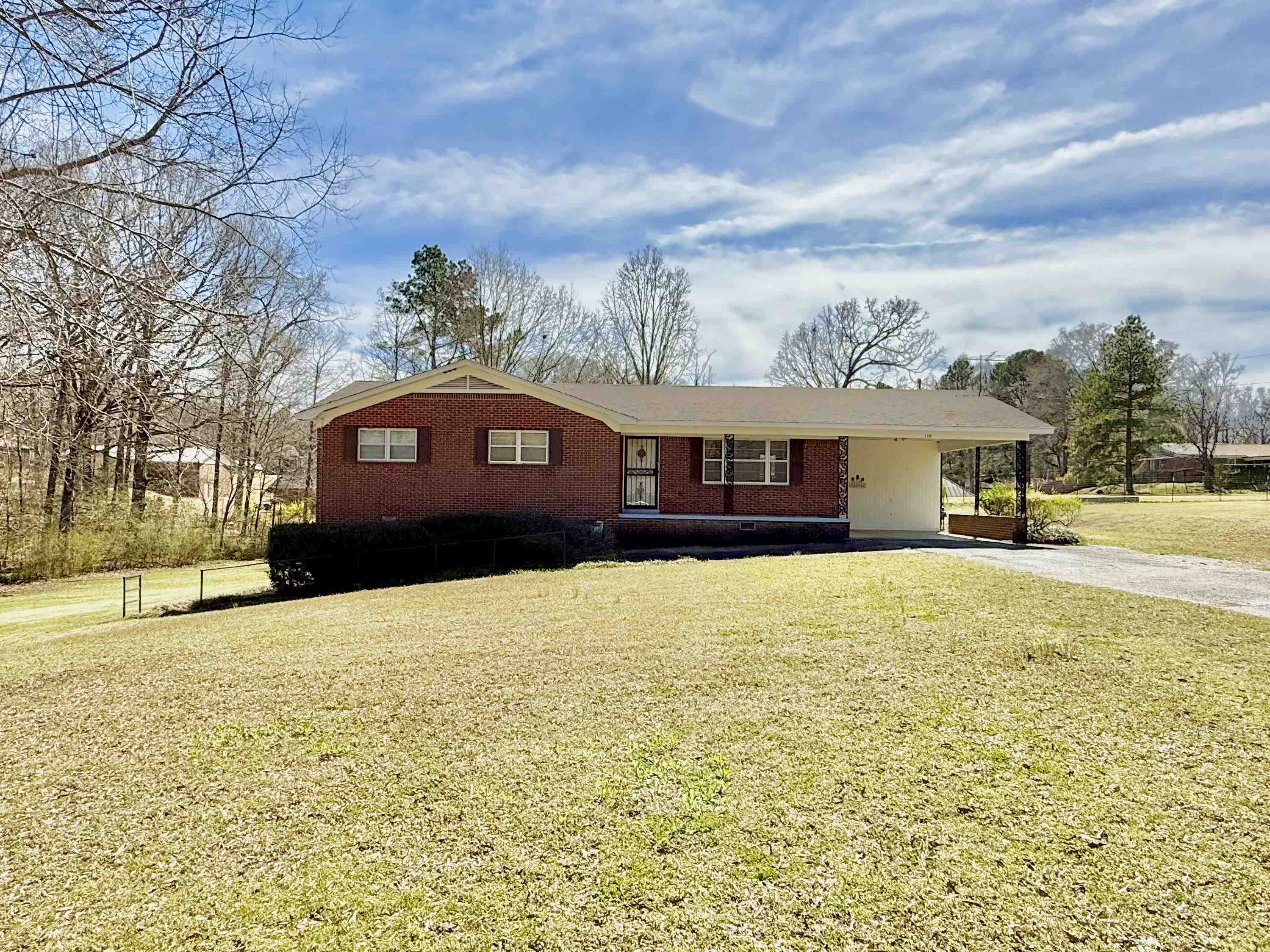115 Robertson Drive Somerville, TN 38068 - Photo 1 of 19 a front view of a house with a yard