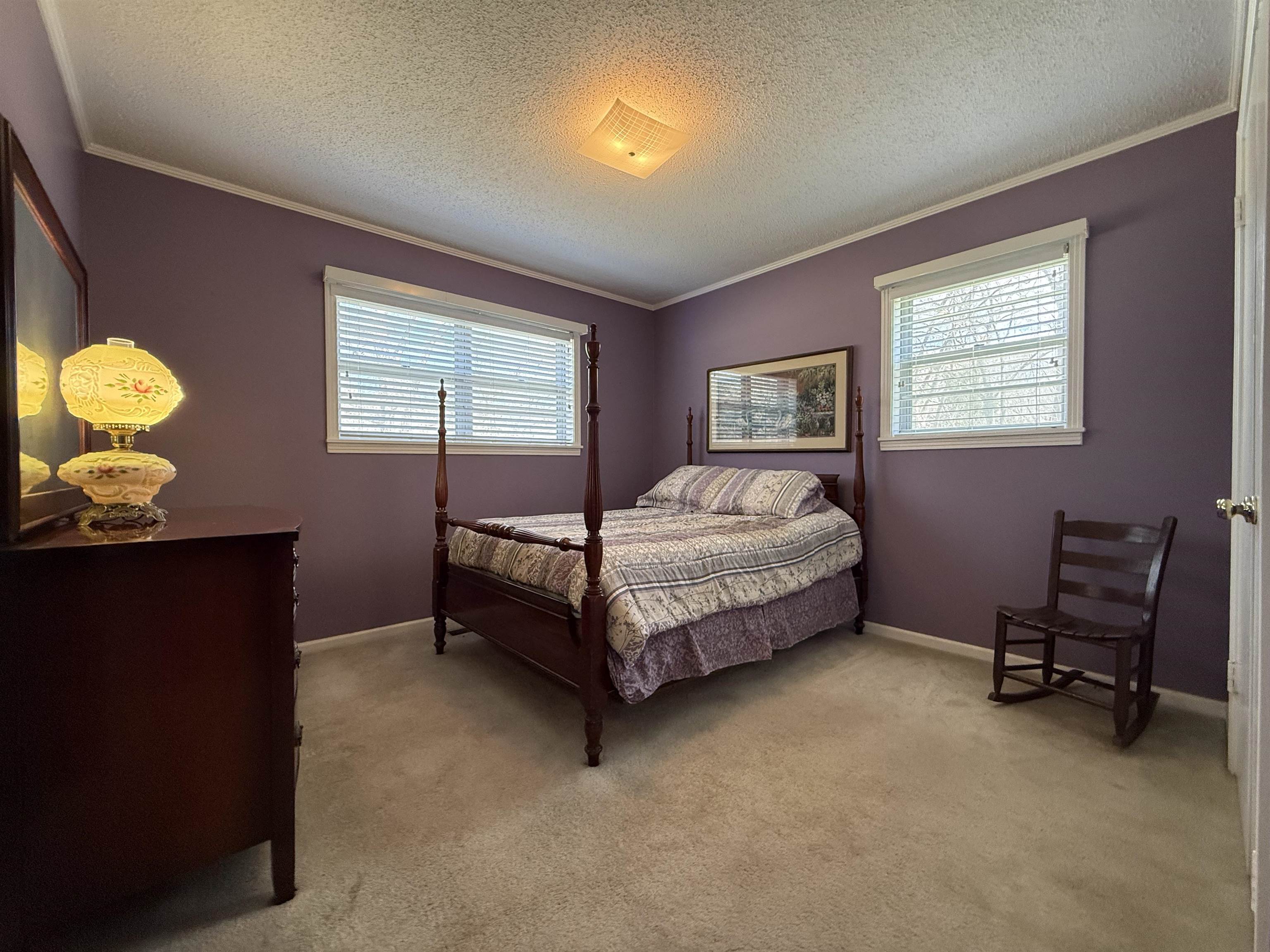 115 Robertson Drive Somerville, TN 38068 - Photo 14 of 19 a bed sitting in a bedroom next to a window