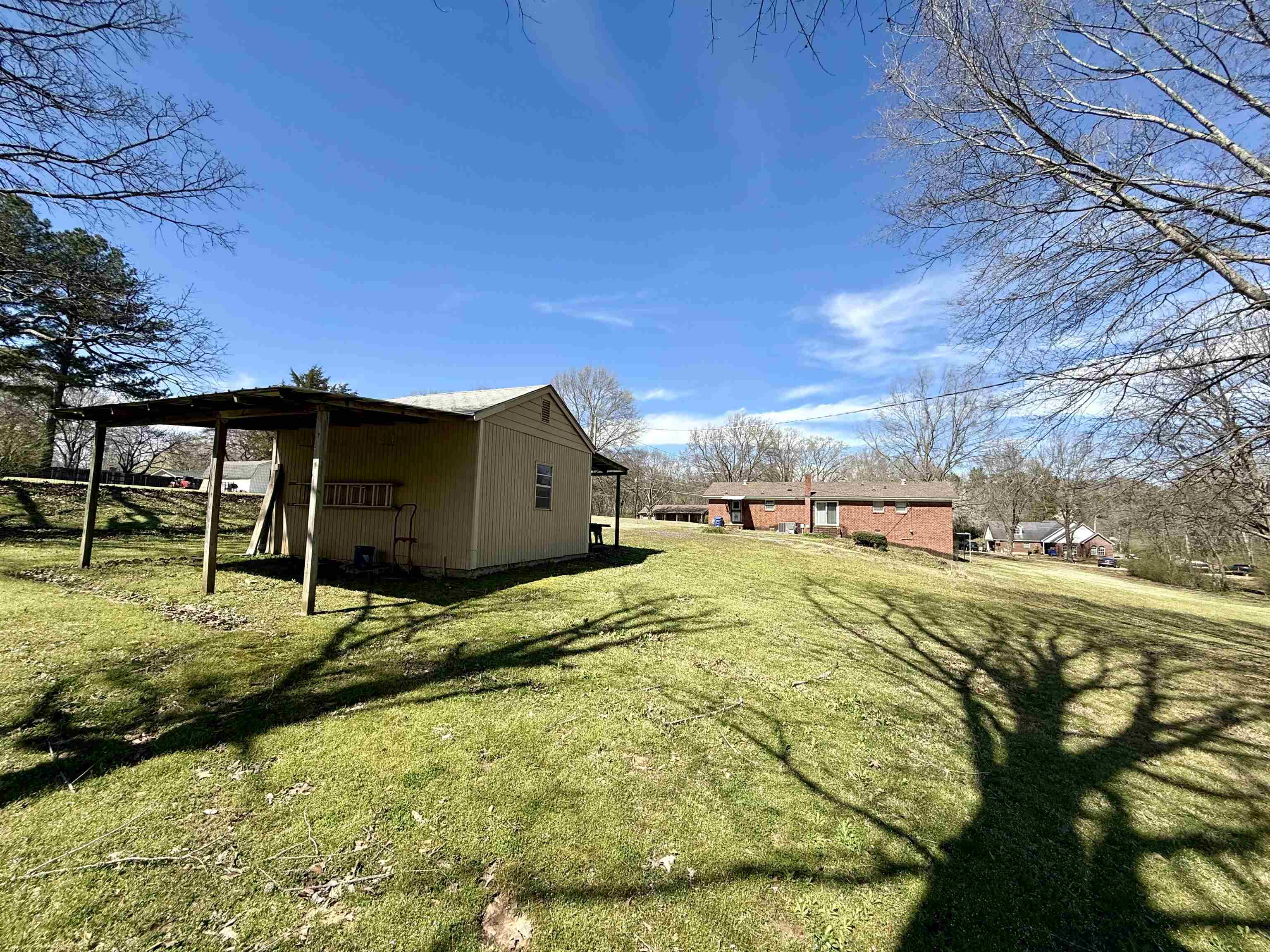 115 Robertson Drive Somerville, TN 38068 - Photo 19 of 19 a view of a house with a yard