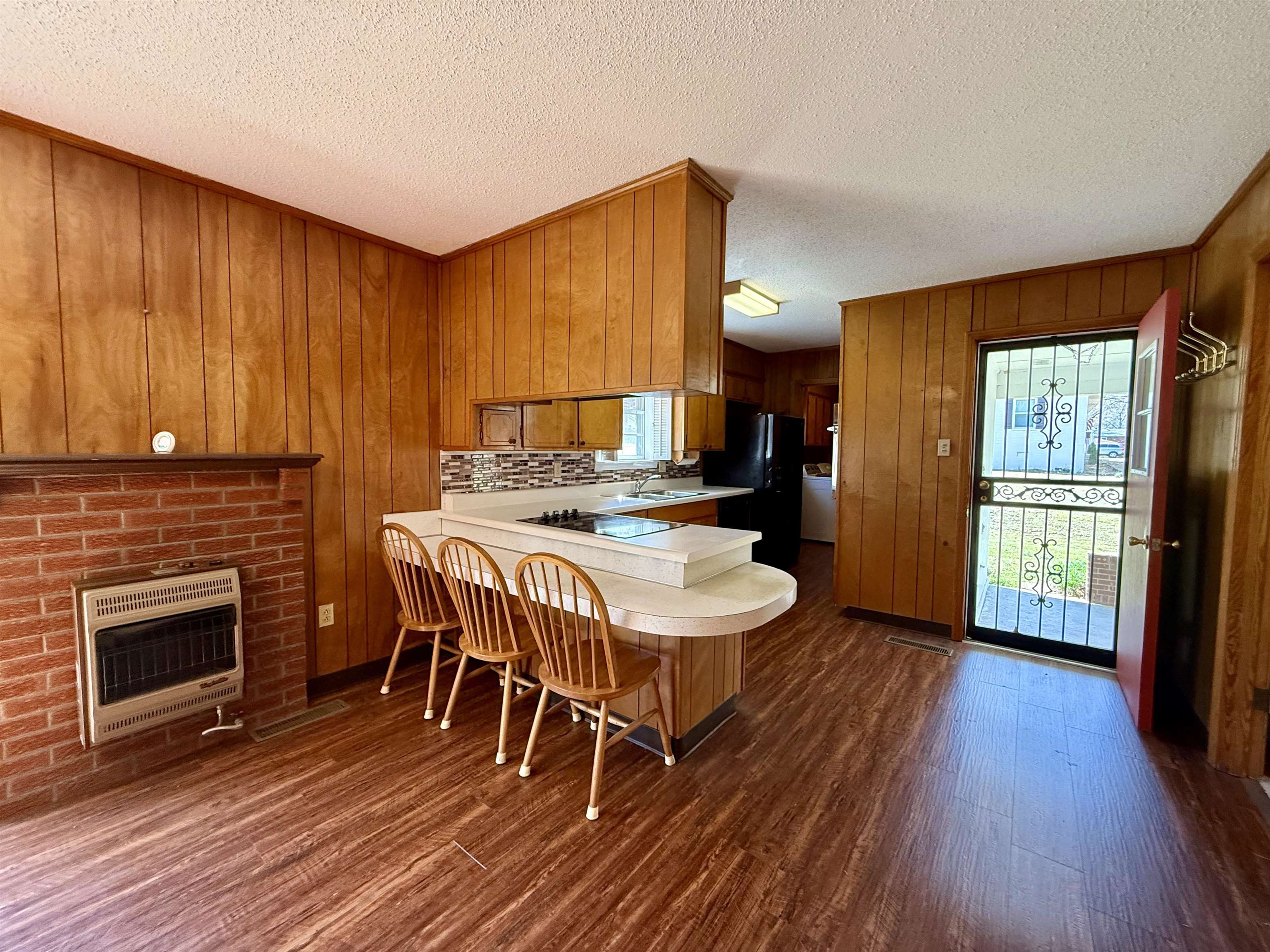 115 Robertson Drive Somerville, TN 38068 - Photo 6 of 19 a dining room with furniture a fireplace and wooden floor