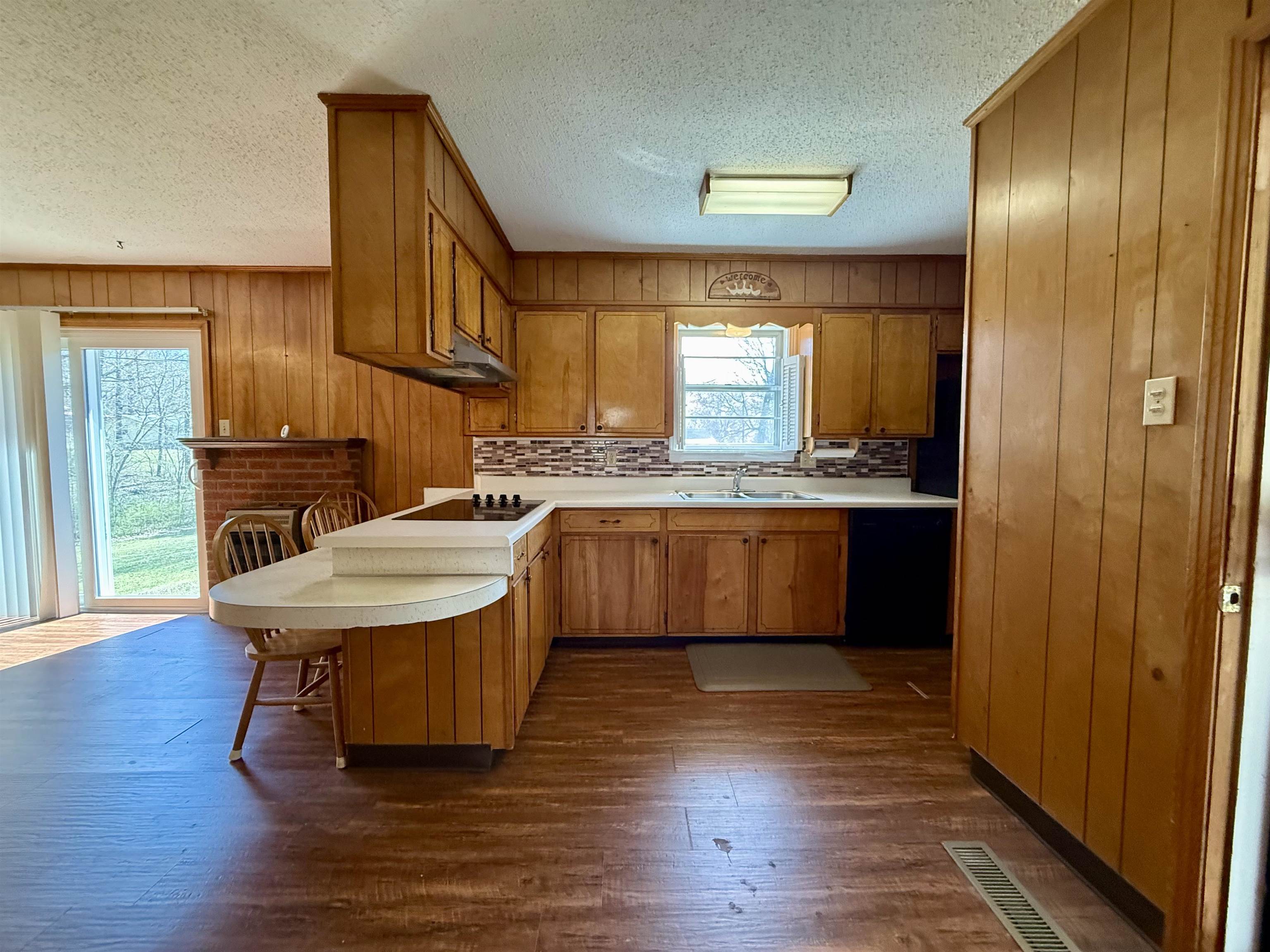 115 Robertson Drive Somerville, TN 38068 - Photo 7 of 19 a kitchen with a sink cabinets and wooden floor