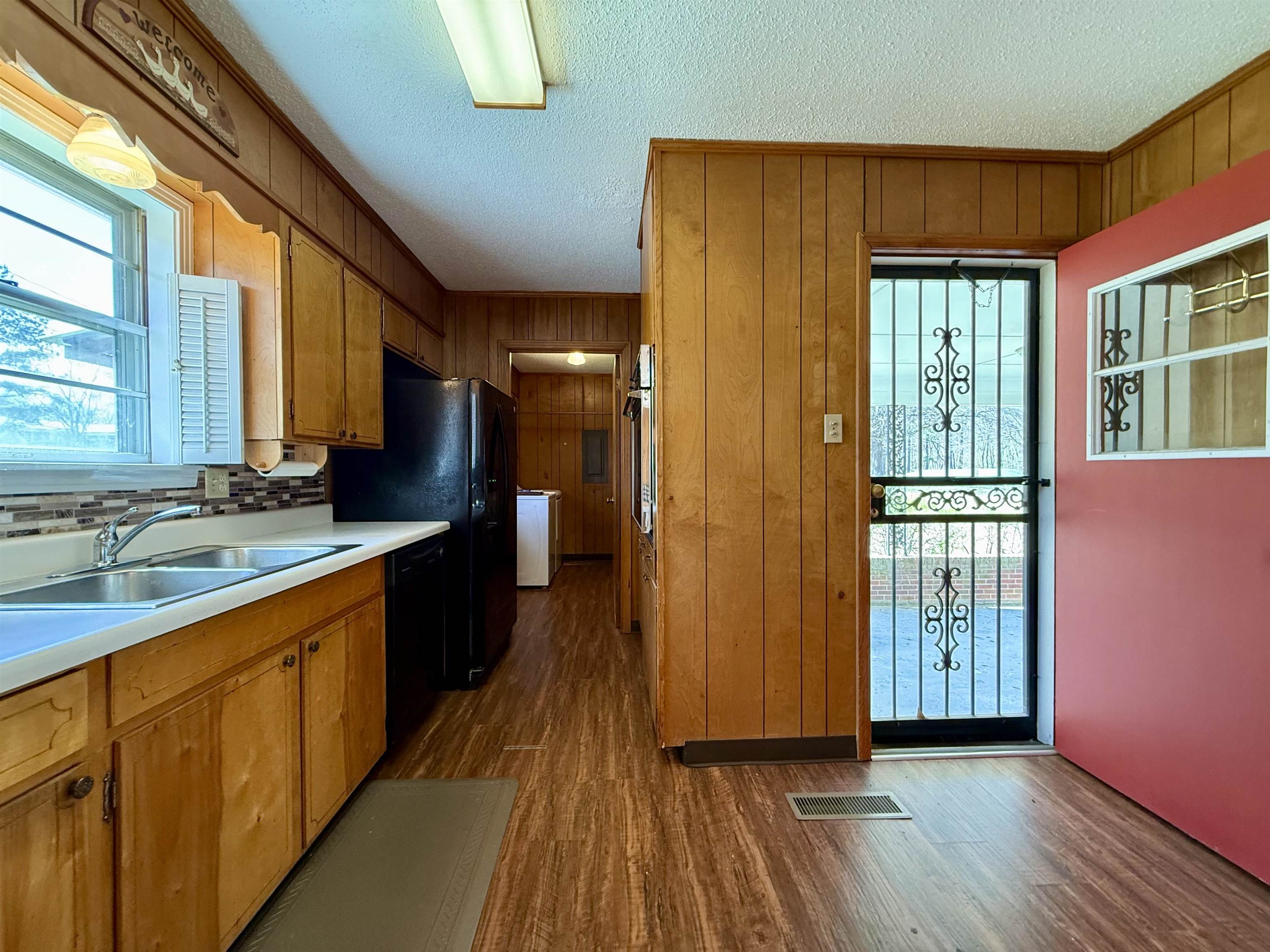 115 Robertson Drive Somerville, TN 38068 - Photo 9 of 19 a large kitchen with a sink and wooden floor