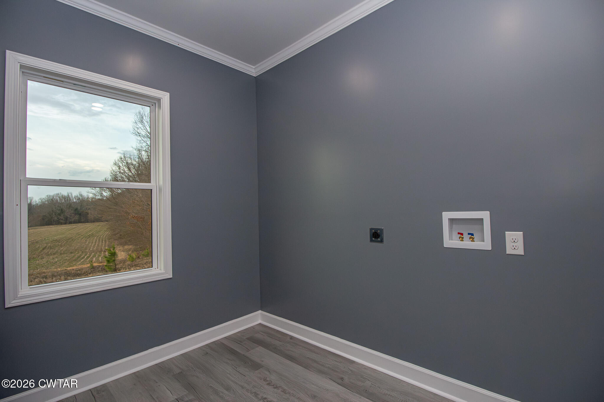 6523 Alamo Gadsden Road Gadsden, TN 38337 - Photo 15 of 25 a view of a small space with wooden floor and a window