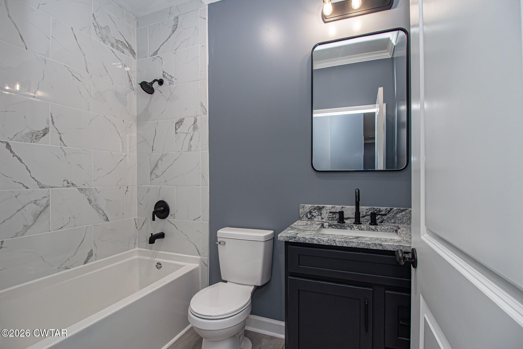 6523 Alamo Gadsden Road Gadsden, TN 38337 - Photo 18 of 25 a bathroom with a toilet sink vanity tub and shower