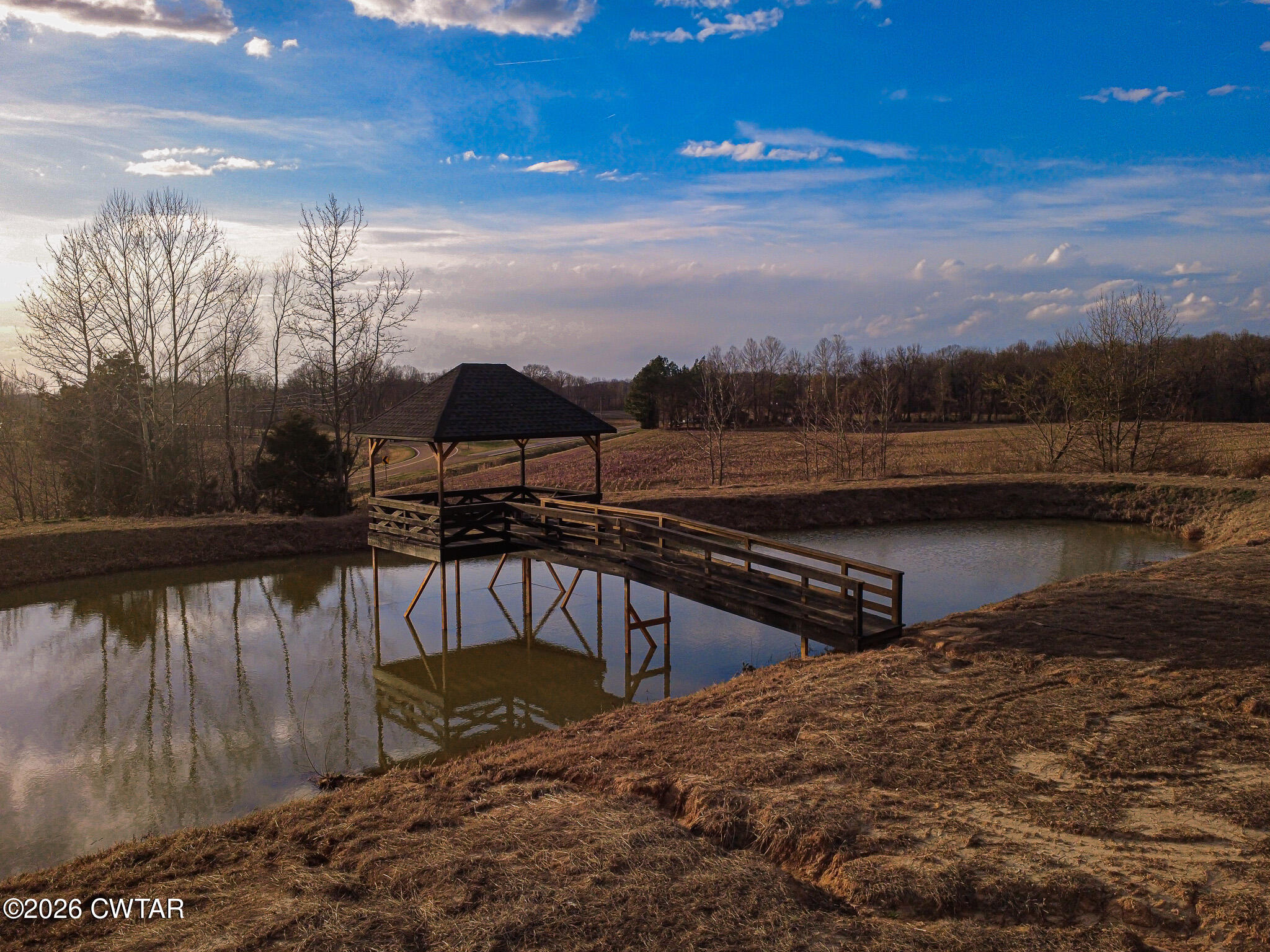 6523 Alamo Gadsden Road Gadsden, TN 38337 - Photo 20 of 25 a view of a lake with a mountain