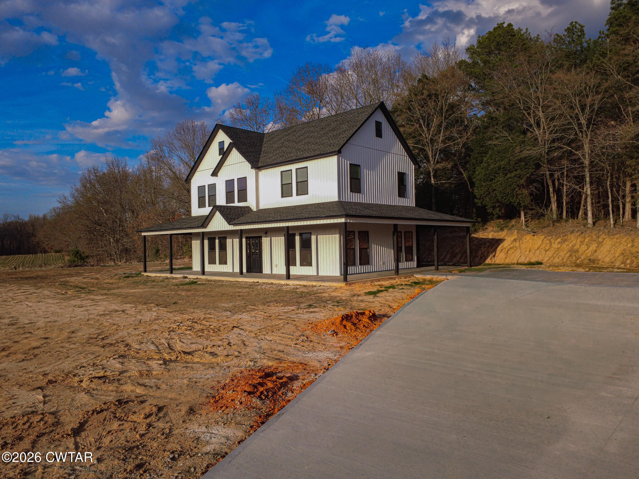 6523 Alamo Gadsden Road Gadsden, TN 38337 - Photo 4 of 25 a front view of a house with a yard table and chairs