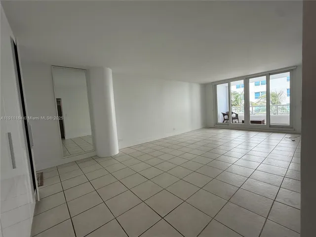 a kitchen with granite countertop a stove a sink and a microwave