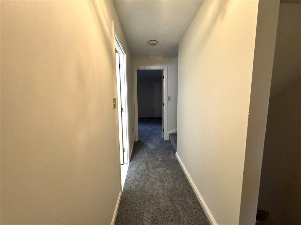 224 Park Street, Unit C8 Stoneham, MA 02180 - Photo 11 of 18 a view of a hallway with wooden floor