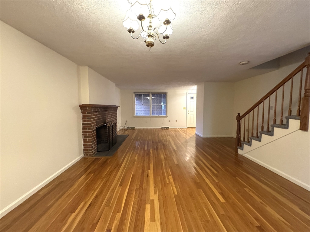 224 Park Street, Unit C8 Stoneham, MA 02180 - Photo 5 of 18 a view of livingroom with wooden floor