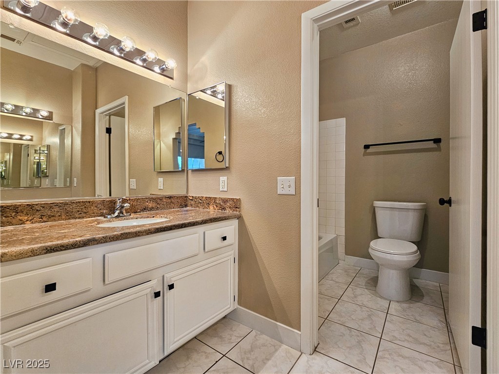 1851 Hillpointe Road, Unit 2124 Henderson, NV 89074 - Photo 18 of 24 Full bathroom featuring marble finish floor, vanity, toilet, and visible vents