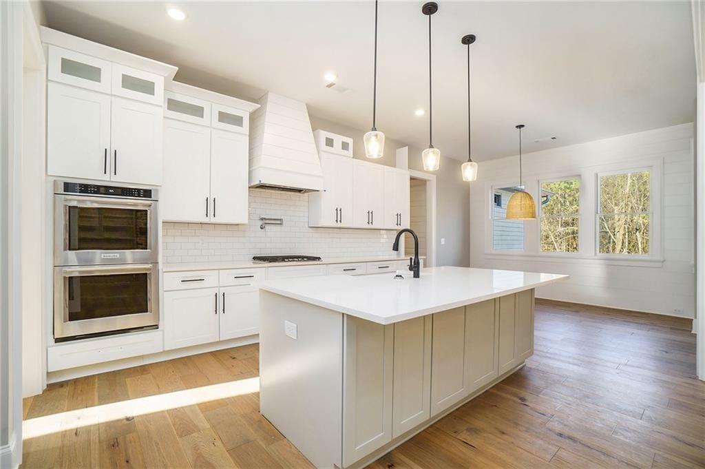 711 Hornage Road Ball Ground, GA 30107 - Photo 36 of 61 a kitchen with a sink cabinets and window