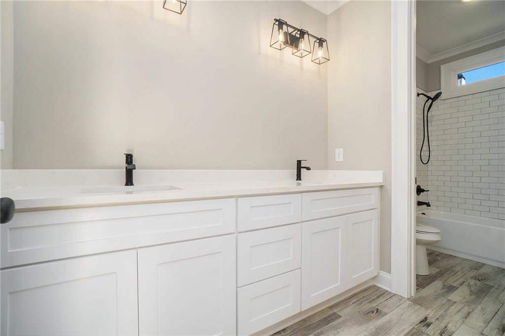 711 Hornage Road Ball Ground, GA 30107 - Photo 47 of 61 a bathroom with a sink and a mirror