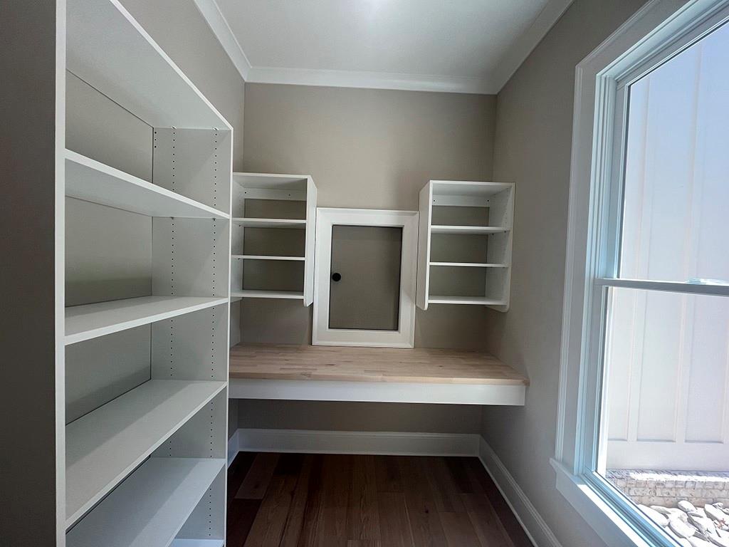 711 Hornage Road Ball Ground, GA 30107 - Photo 8 of 61 a hallway with closet and wooden floor