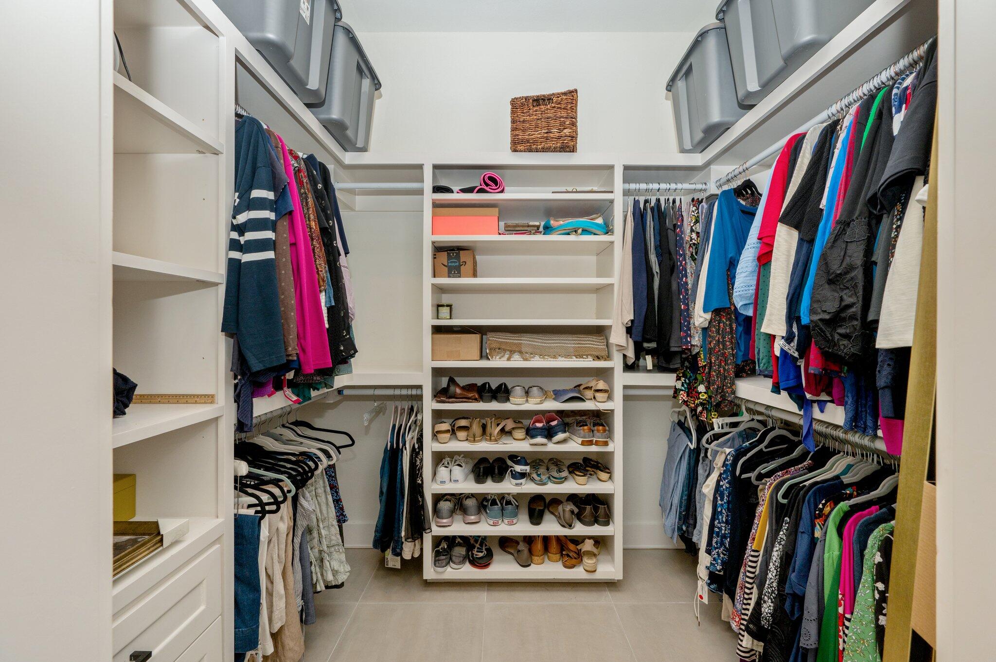 164 Bay Trace Santa Rosa Beach, FL 32459 - Photo 33 of 90 a view of walk in closet with clothes and shoes