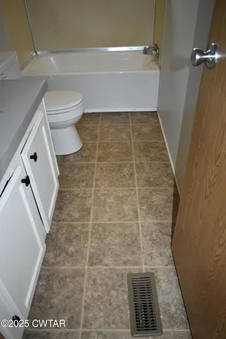 a kitchen with stainless steel appliances granite countertop a stove and a refrigerator