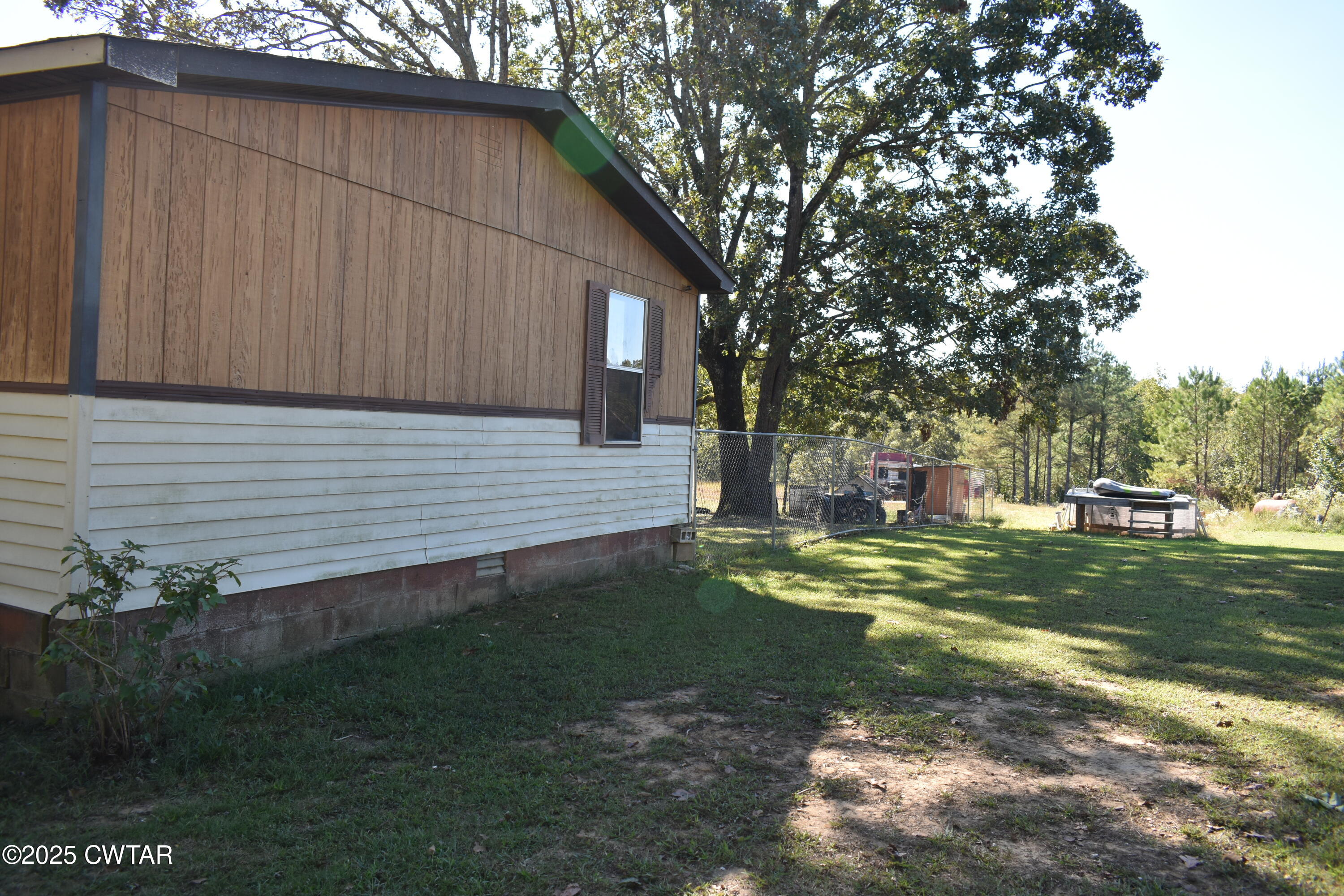 825 Verles King Road Medon, TN 38356 - Photo 45 of 91 a view of a backyard with plants and large trees