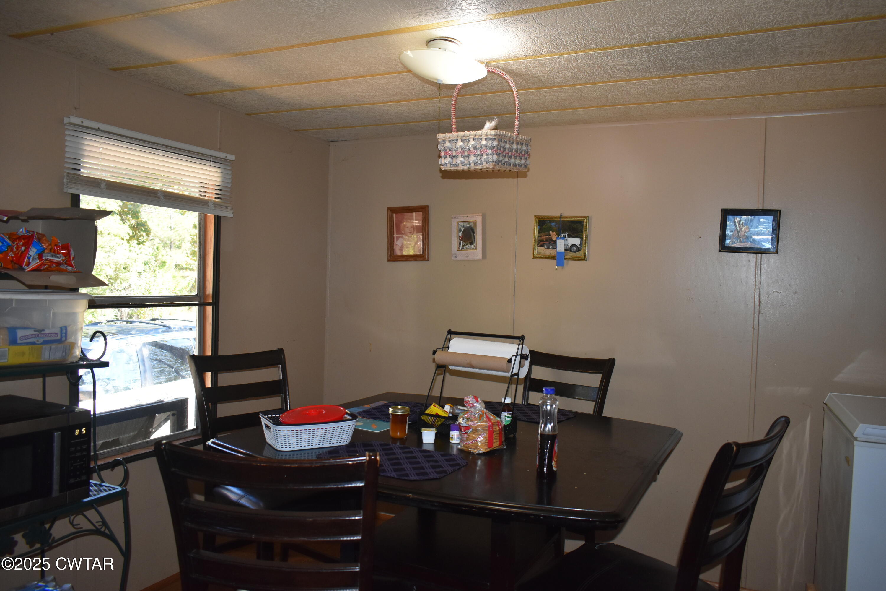 825 Verles King Road Medon, TN 38356 - Photo 54 of 91 a view of a dining room with furniture a chandelier and window
