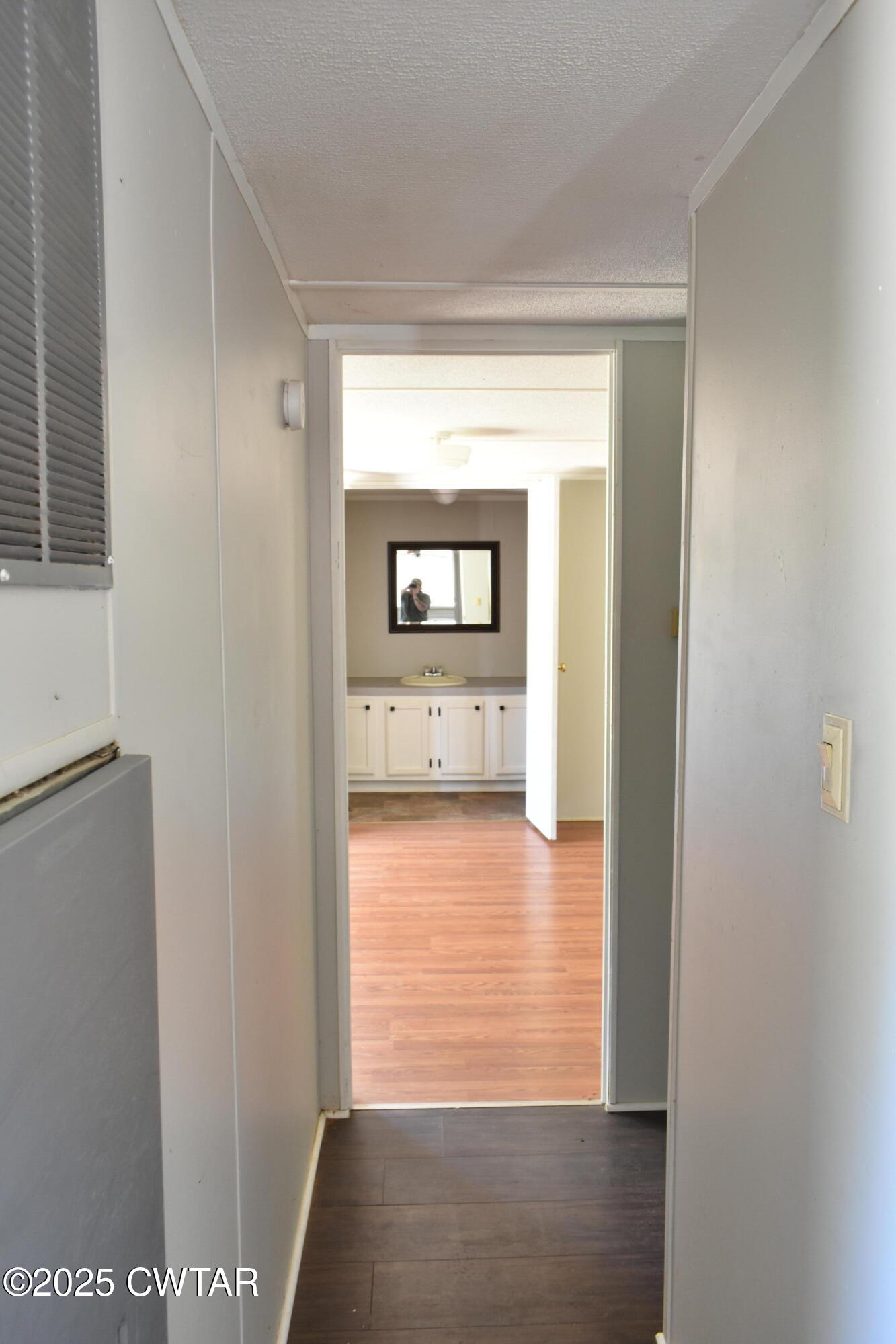 825 Verles King Road Medon, TN 38356 - Photo 7 of 91 a view of a hallway with wooden floor and a living room