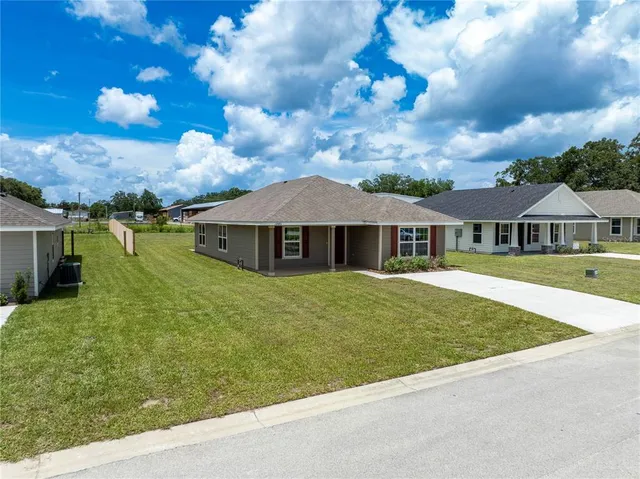 a front view of house with yard and seating