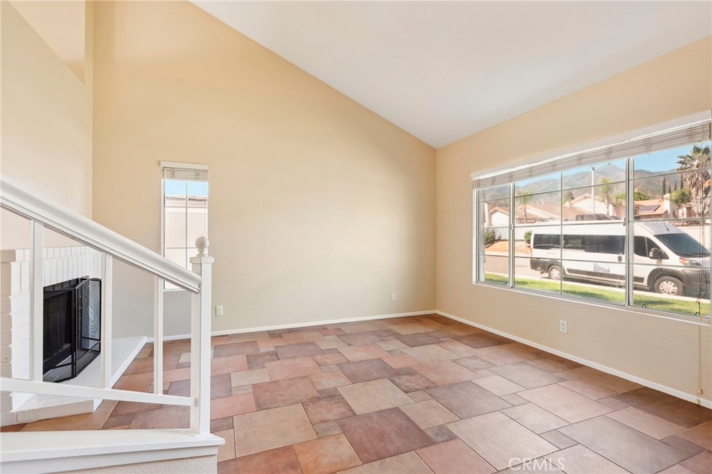 26658 Caravan Circle Corona, CA 92883 - Photo 12 of 50 a view of an empty room with wooden floor and a window